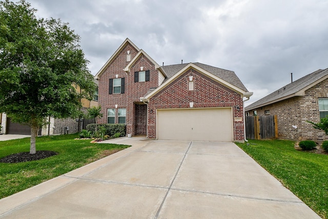 traditional home with an attached garage, a front yard, fence, and brick siding