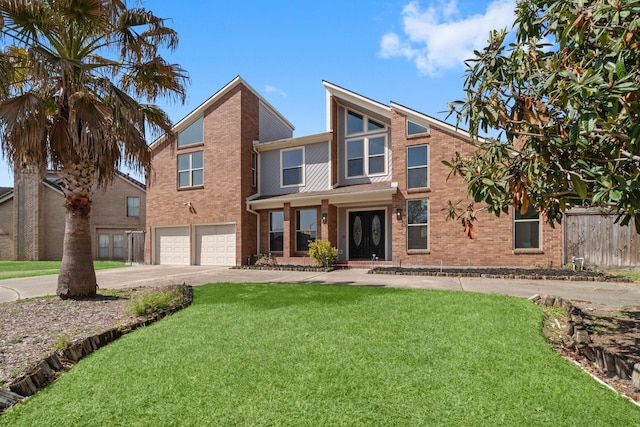 view of front of property with a front lawn, fence, concrete driveway, an attached garage, and brick siding