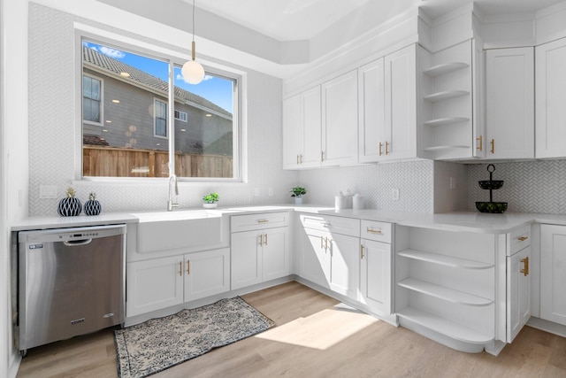 kitchen featuring open shelves, dishwasher, light wood-style floors, white cabinetry, and a sink