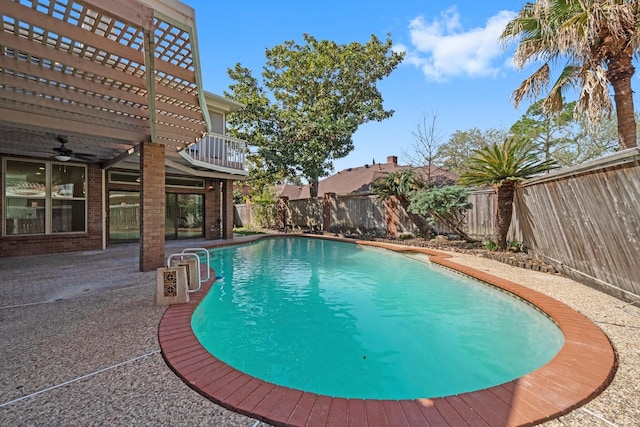 view of swimming pool featuring a patio area, a fenced in pool, and a fenced backyard