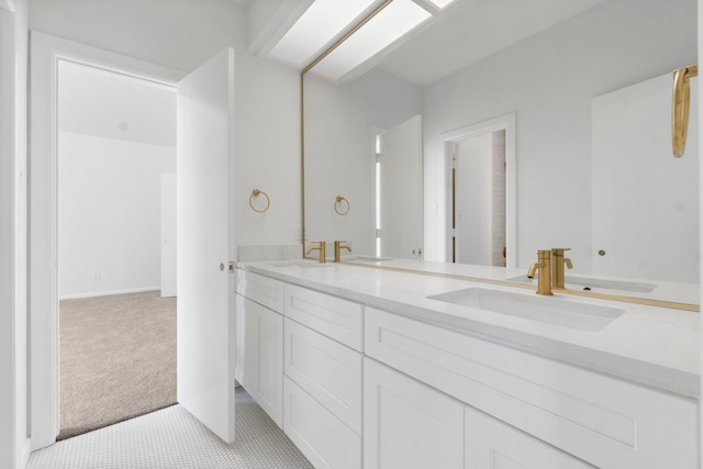 full bathroom featuring double vanity and a sink