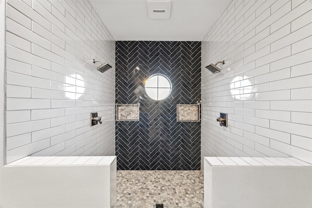 full bath featuring a tile shower