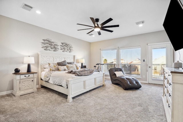 carpeted bedroom featuring baseboards, recessed lighting, visible vents, and access to exterior