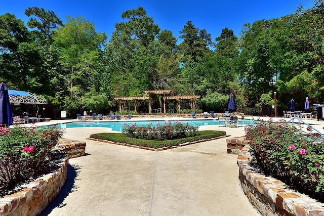 community pool featuring a patio area and a pergola