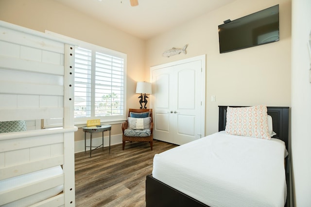 bedroom featuring baseboards and wood finished floors