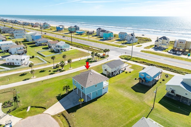 drone / aerial view with a residential view and a water view