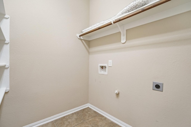 laundry room with washer hookup, light tile patterned floors, electric dryer hookup, laundry area, and baseboards