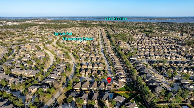 bird's eye view with a water view and a residential view