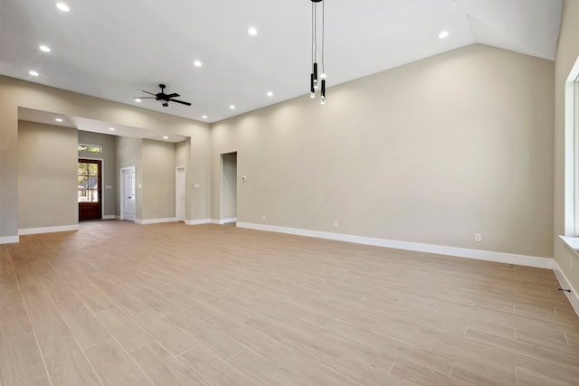 unfurnished room featuring recessed lighting, ceiling fan, light wood-style flooring, and baseboards