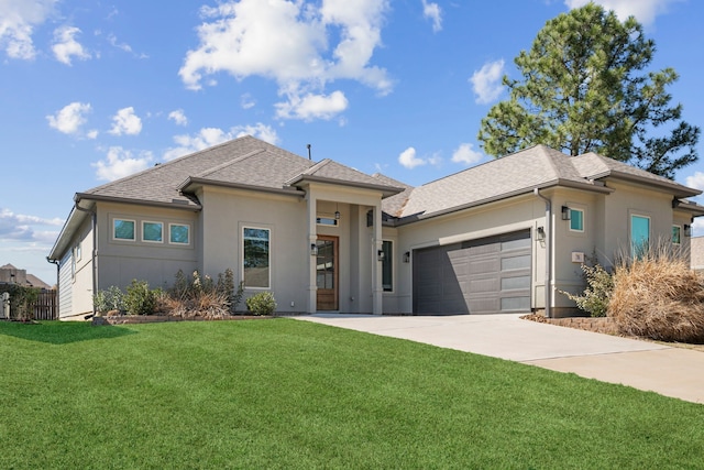 prairie-style house with a garage, concrete driveway, a front lawn, and stucco siding