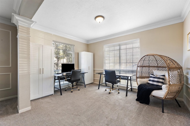 office area featuring ornamental molding, a wealth of natural light, ornate columns, and carpet