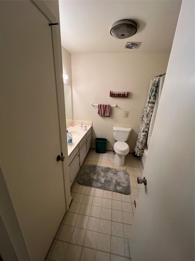 bathroom featuring visible vents, tile patterned flooring, vanity, and toilet