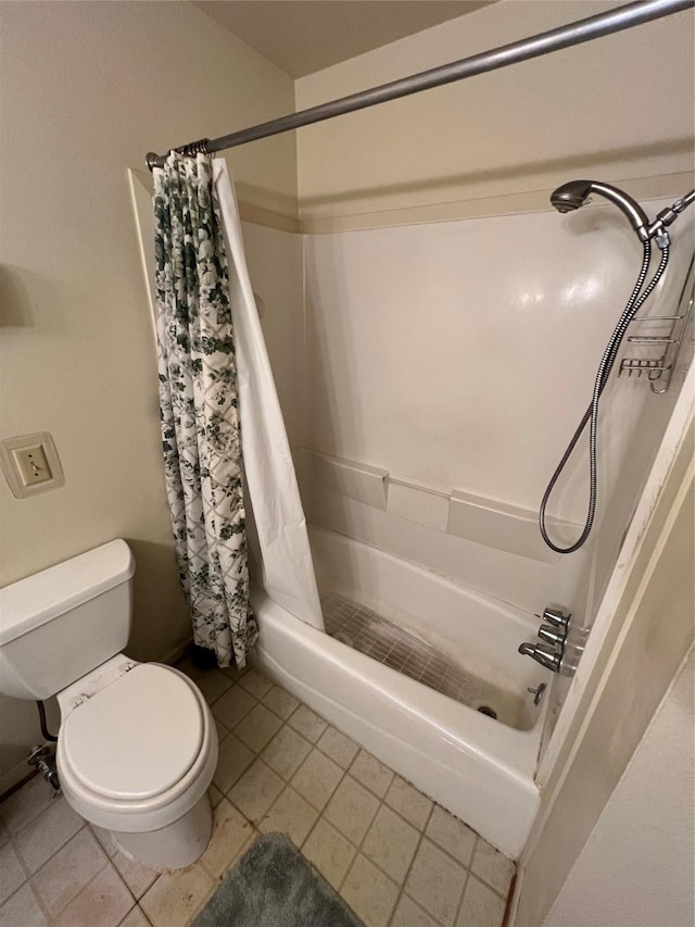 bathroom with tile patterned flooring and toilet