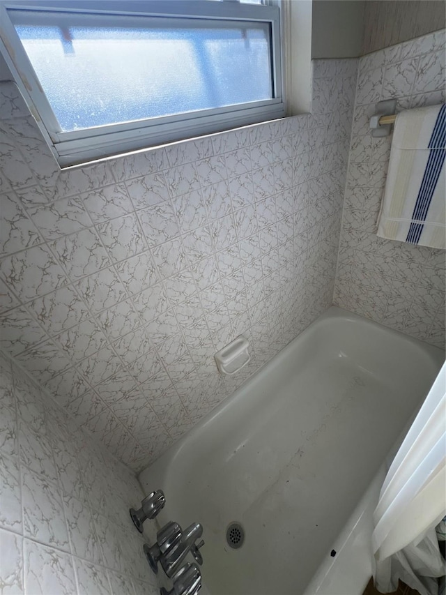 bathroom featuring a washtub