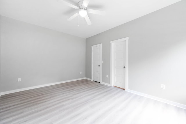 unfurnished bedroom with ceiling fan, light wood-type flooring, and baseboards