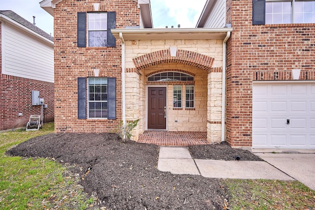 entrance to property featuring stone siding and brick siding