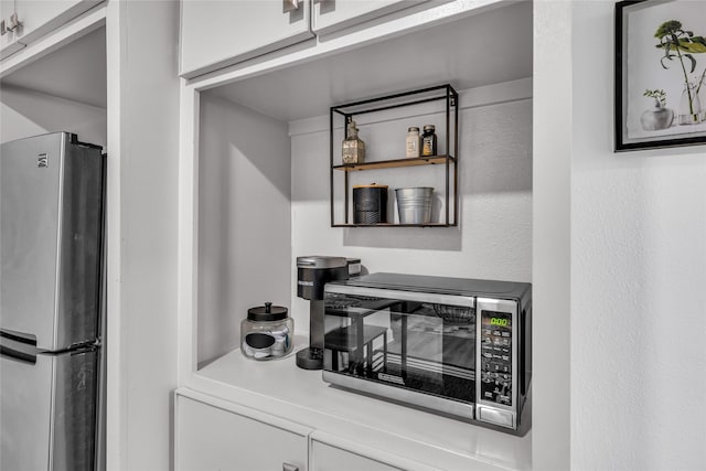 kitchen with appliances with stainless steel finishes and light countertops