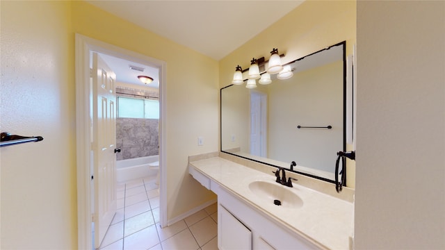 full bath with vanity, baseboards, visible vents, tile patterned floors, and a bathtub