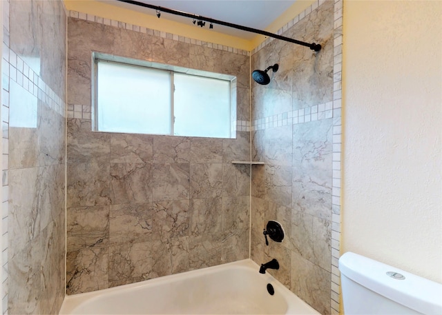 bathroom featuring toilet and shower / tub combination