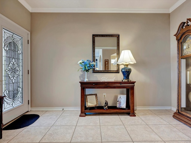 entryway featuring tile patterned flooring, ornamental molding, and baseboards