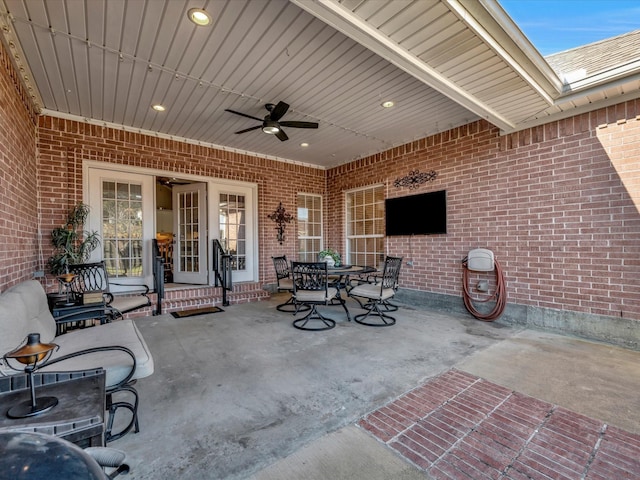 view of patio featuring outdoor dining space and a ceiling fan