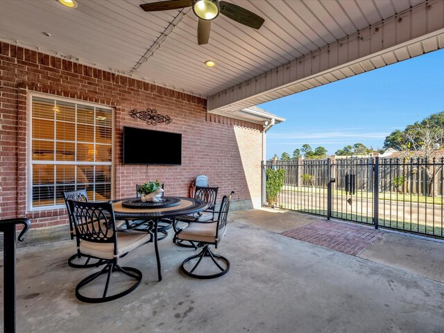 2601 Woodstock Dr, Lufkin, TX 75904 - view of patio / terrace featuring ceiling fan, fence, and outdoor dining area