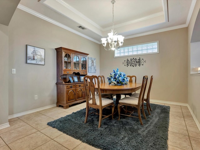 dining space featuring light tile patterned floors, a raised ceiling, ornamental molding, a chandelier, and baseboards