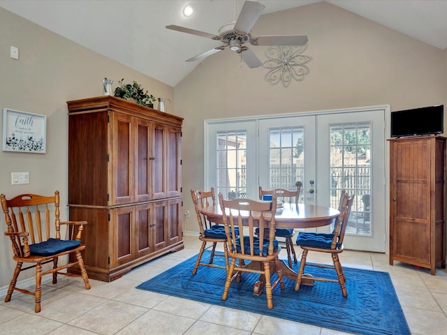 dining area featuring high vaulted ceiling, french doors, plenty of natural light, and light tile patterned floors