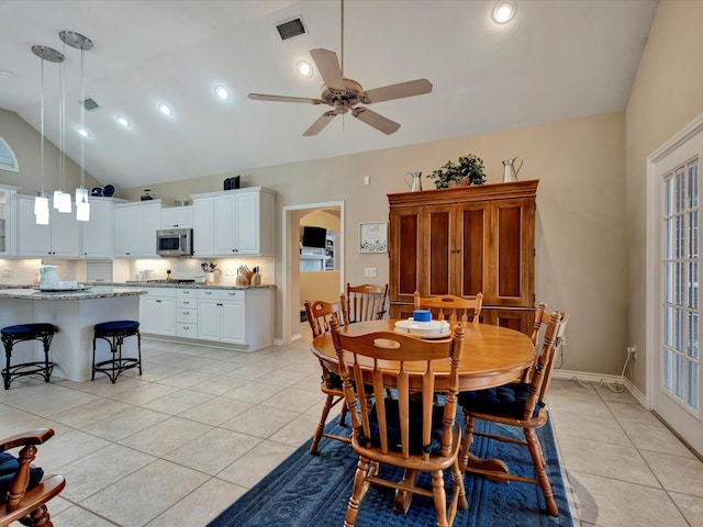 dining space with ceiling fan, visible vents, baseboards, and light tile patterned flooring