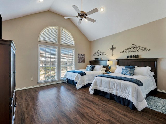 bedroom featuring dark wood-style floors, high vaulted ceiling, baseboards, and a ceiling fan