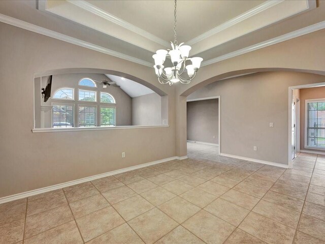 2601 Woodstock Dr, Lufkin, TX 75904 - tiled empty room with arched walkways, plenty of natural light, a chandelier, a raised ceiling, and crown molding