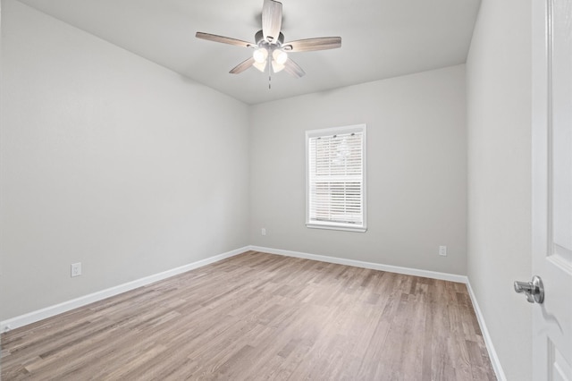 unfurnished room with a ceiling fan, light wood-style flooring, and baseboards