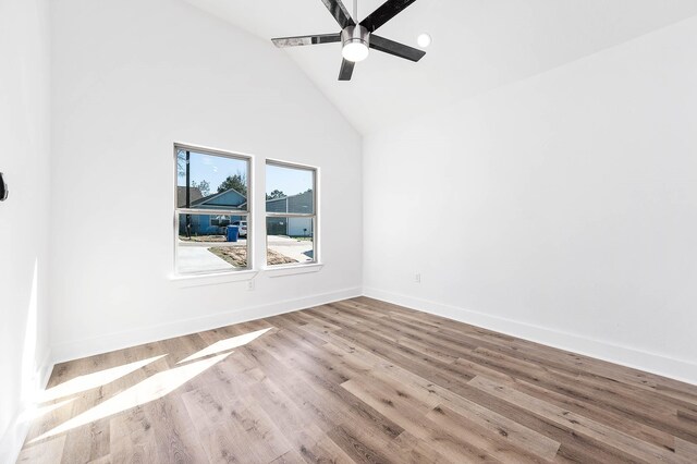 16978 W Hammon St, Montgomery, TX 77316 - empty room featuring high vaulted ceiling, ceiling fan, baseboards, and wood finished floors