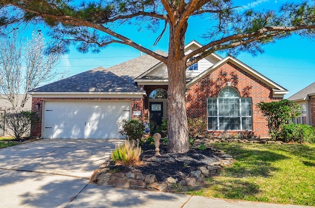 ranch-style home featuring brick siding, roof with shingles, concrete driveway, a garage, and a front lawn