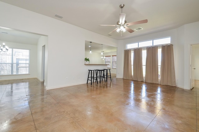 spare room with plenty of natural light, visible vents, and baseboards