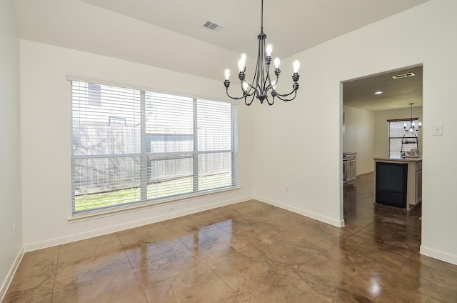 dining space with visible vents, a notable chandelier, and baseboards