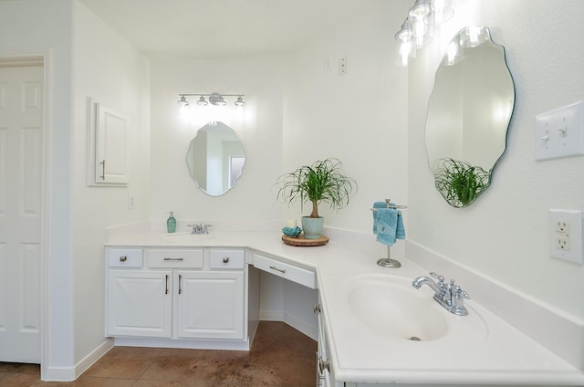 bathroom featuring double vanity, a sink, and tile patterned floors