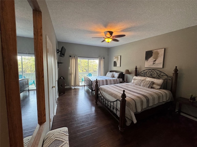 bedroom featuring access to exterior, ceiling fan, a textured ceiling, and wood finished floors