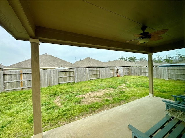 exterior space featuring ceiling fan and a fenced backyard