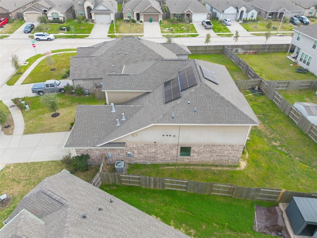 birds eye view of property with a residential view