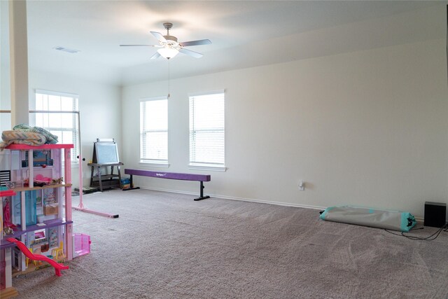 18802 Verdura Dr, New Caney, TX 77357 - recreation room featuring visible vents, ceiling fan, carpet, and baseboards