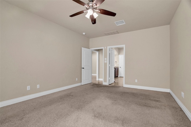 interior space with baseboards, visible vents, and a ceiling fan