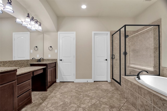 full bath featuring a garden tub, a shower stall, tile patterned flooring, and vanity