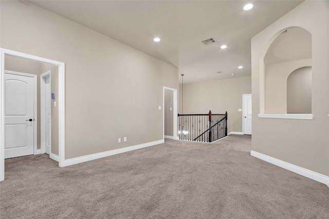 carpeted spare room with recessed lighting, visible vents, and baseboards