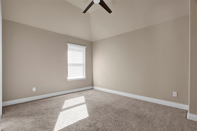 empty room with carpet floors, lofted ceiling, and baseboards