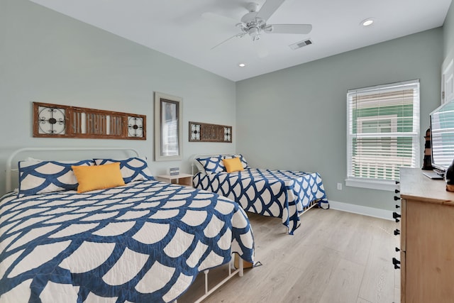 bedroom with recessed lighting, a ceiling fan, visible vents, baseboards, and light wood-type flooring