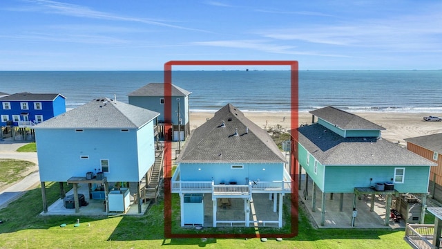 exterior space with a beach view and a water view