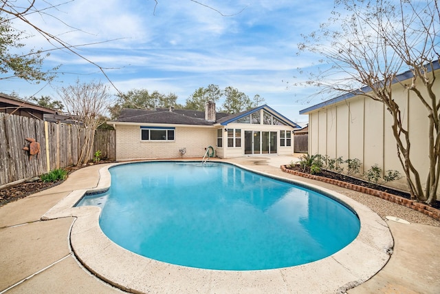 view of swimming pool with a patio area, a fenced backyard, and a fenced in pool