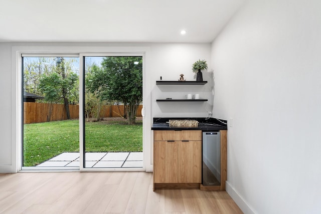 entryway featuring light wood-type flooring, baseboards, and recessed lighting