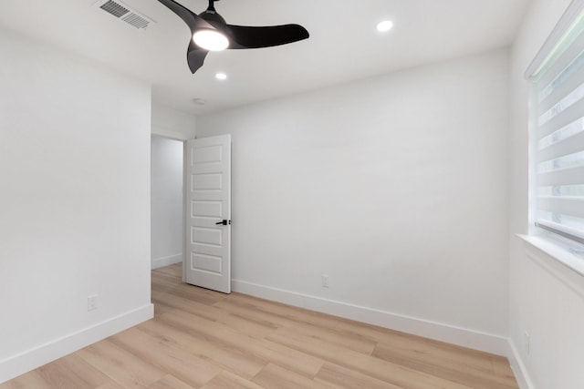 unfurnished room featuring baseboards, visible vents, ceiling fan, light wood-type flooring, and recessed lighting